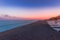 Perissa, beach at sunset, Santorini, Greece with beautiful beach huts, blue sky and clouds Royalty Free Stock Photo