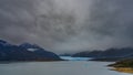 The beautiful Perito Moreno glacier is visible between the mountain slopes.