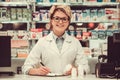 Beautiful pharmacist at work