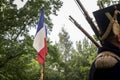 France flag behind the ranks of napoleonic soldiers