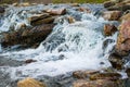 Beautiful photo of a small falls through boulders making a brook from a lake in the mountains of Snowdonia, Wales Royalty Free Stock Photo