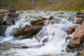 Beautiful photo of a small falls through boulders making a brook from a lake in the mountains of Snowdonia, Wales Royalty Free Stock Photo