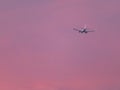 Beautiful photo of a sunset with plane of nice color in the clouds