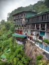 Beautiful photo of traditional house on the mountain slope in rain on Sri Lanka