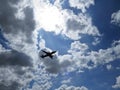 Beautiful Photograph of Airplane Plane Aircraft Flying in Blue Sky with White Clouds Royalty Free Stock Photo