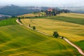 Wonderful misty Tuscany landscape with curved road and cypresses, Italy Royalty Free Stock Photo