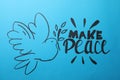 Beautiful phrase Make Peace with pigeon on blue background