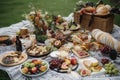 a beautiful picnic spread with platters of food, blankets, and baskets