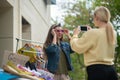 Pretty young woman taking photos of her friend Royalty Free Stock Photo