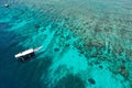 Aerial shot of boat on tropical reef