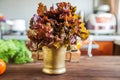 Beautiful picture of eating salad. Salad leaves in a bronze mortar on a stylish kitchen background. Background for text Royalty Free Stock Photo