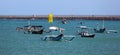 Beautiful picture of fishing boats at Jimbaran Bay at Bali Indonesia, beach, ocean, fishing boats and airport in photo. Royalty Free Stock Photo