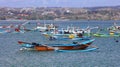 Beautiful picture of fishing boats at Jimbaran Bay at Bali Indonesia, beach, ocean, fishing boats and airport in photo. Royalty Free Stock Photo