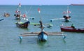 Beautiful picture of fishing boats at Jimbaran Bay at Bali Indonesia, beach, ocean, fishing boats and airport in photo. Royalty Free Stock Photo