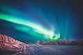 Beautiful picture of massive multicolored green vibrant Aurora Borealis, also known as Northern Lights, Sweden, Lapland