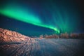 Beautiful picture of massive multicolored green vibrant Aurora Borealis, also known as Northern Lights, Sweden, Lapland