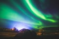 Beautiful picture of massive multicolored green vibrant Aurora Borealis, Aurora Polaris, also know as Northern Lights in Norway Royalty Free Stock Photo