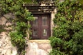 An old brick wall with a frame of a window laid with bricks over Royalty Free Stock Photo