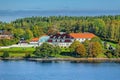 Beautiful picturesque private waterfront mansion in skargard archipelago at early autumn sunny moring. Stockholm, Sweden Royalty Free Stock Photo