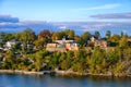 Beautiful picturesque private waterfront mansion in Stockholm skargard archipelago at early autumn sunny evening. Stockholm, Royalty Free Stock Photo