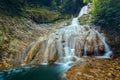 Beautiful and Picturesque Waterfall In Deep Forest In Summer Closeup