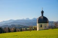 Beautiful pilgrimage chapel Veitskapelle Wilparting, landscape Irschenberg, view to bavarian alps