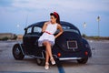 Beautiful pin-up girl posing with hot road car Royalty Free Stock Photo