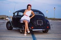 Beautiful pin-up girl posing with hot road car Royalty Free Stock Photo