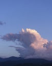 Beautiful pink and blue cloud over mountains. Blue sky. Royalty Free Stock Photo