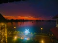 Beautiful Pink & Blue Sunset Sky with Lake & Decorative Lights in Kerala, India