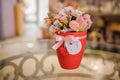Beautiful pink bouquet of mixed flowers in basket on table Royalty Free Stock Photo