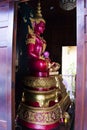 Beautiful pink buddha statues for thai people travelers travel visit and respect praying blessing holy mystery worship at Wat