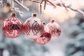 Beautiful pink Christmas tree baubles hanging from snow covered branches Royalty Free Stock Photo