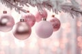 Beautiful pink Christmas tree baubles hanging from snow covered branches Royalty Free Stock Photo
