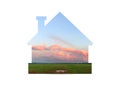 Beautiful pink cloud over the field.Shot through cut-out silhouette of the house Royalty Free Stock Photo