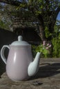 Beautiful pink coffee pot on wooden background Royalty Free Stock Photo