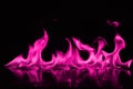 Beautifu pink fire flames on a black background.