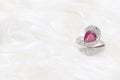 pink gemstone on diamond ring