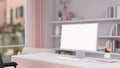 A beautiful pink girlie office room with a white-screen PC computer mockup on a desk