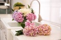 Beautiful pink hydrangea flowers on light countertop, closeup Royalty Free Stock Photo