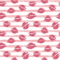 Beautiful pink lips on a background of light pink stripes. Seamless pattern. Lip print. Kisses. Freehand drawing. Royalty Free Stock Photo