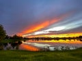 Beautiful pink, orange and blue sunset reflecting on a lake Royalty Free Stock Photo