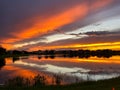 Beautiful pink, orange and blue sunset reflecting on a lake Royalty Free Stock Photo