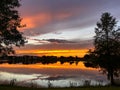 Beautiful pink, orange and blue sunset reflecting on a lake Royalty Free Stock Photo