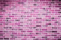 Beautiful pink purple brick wall with white grout, colorful background, abstract texture Royalty Free Stock Photo