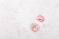 Beautiful pink ranunculus flowers on white table overhead view. Floral border in pastel color. Wedding mockup in flat lay style. Royalty Free Stock Photo