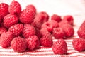 Beautiful pink raspberries on a striped background