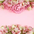 Beautiful pink rose and alstroemeria flowers in top and bottom borders on coral paper