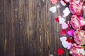 Beautiful pink rose, decorative confetti hearts on Valentines day background Royalty Free Stock Photo