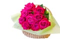 Beautiful pink roses in a wicker basket on a white background Royalty Free Stock Photo